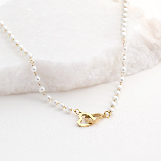 Steel necklace with intertwined hearts and polka dots