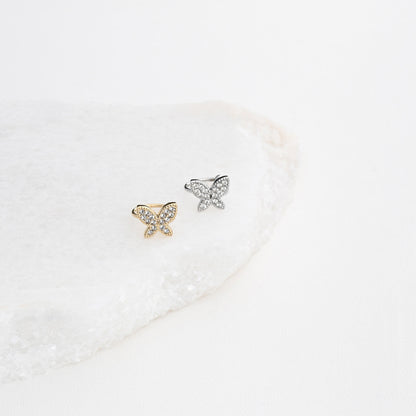 Brincos ear cuff borboleta aço Carmo Joalheiros em dourado e prateado com cristais sobre pedra branca