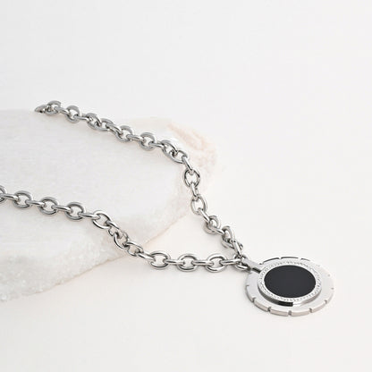 Round steel necklace with mother of pearl