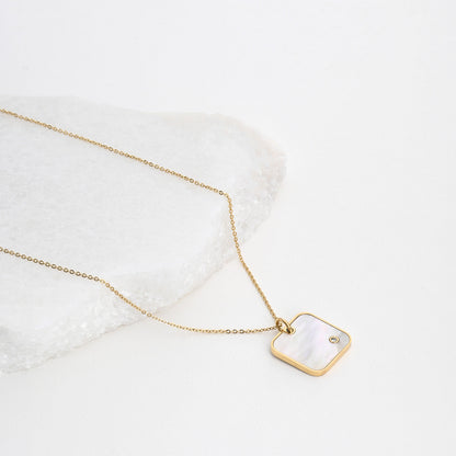 Square steel necklace with mother of pearl. 